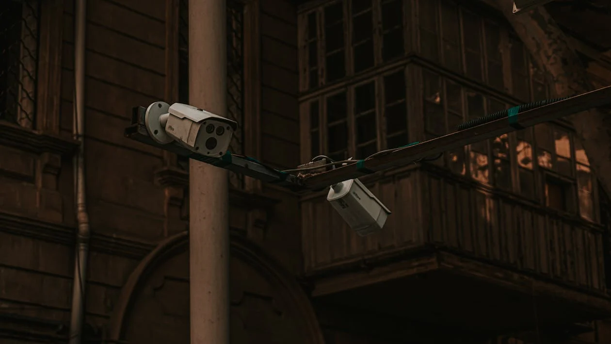 CCTV cameras mounted outside a building, highlighting legal rules and privacy laws for NSW strata community.