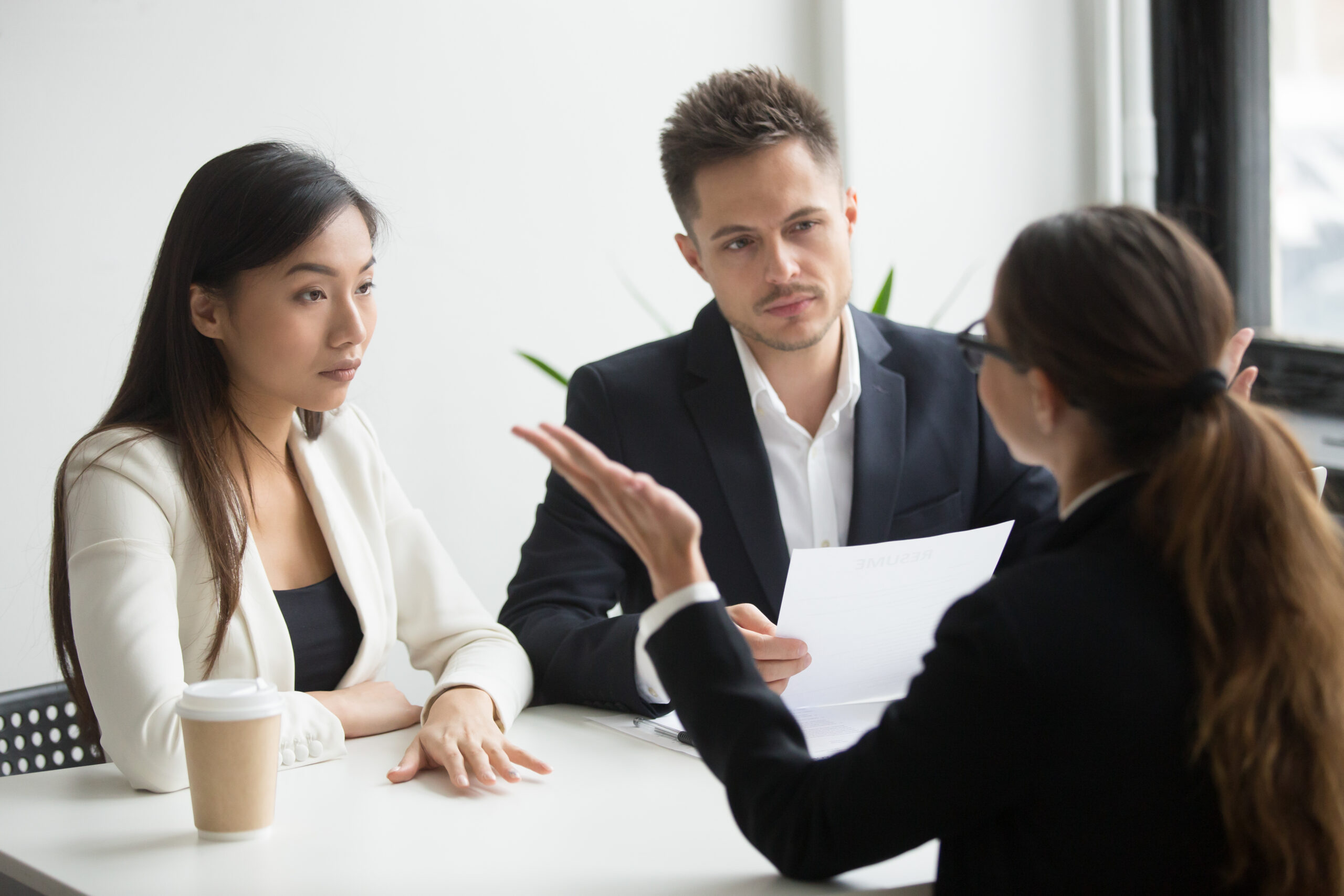 Lawyer discussing will defense strategy with executors in office