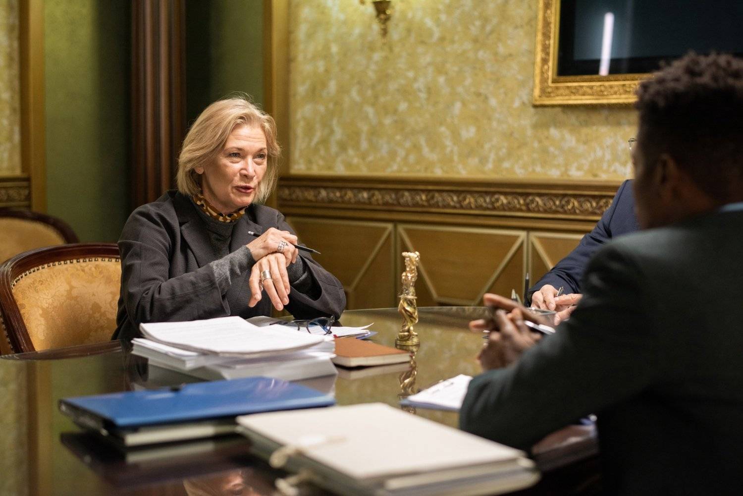 Woman in meeting discussing executor duties, a beneficiary's guide topic.