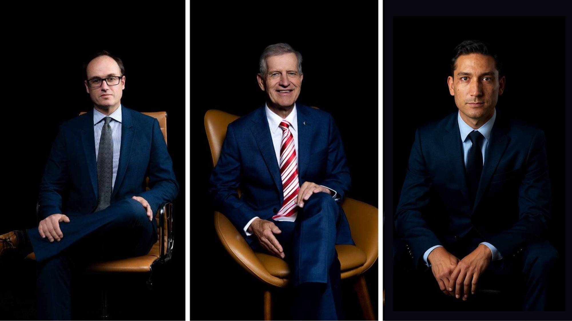 Three businessmen in suits sitting in chairs against a dark background